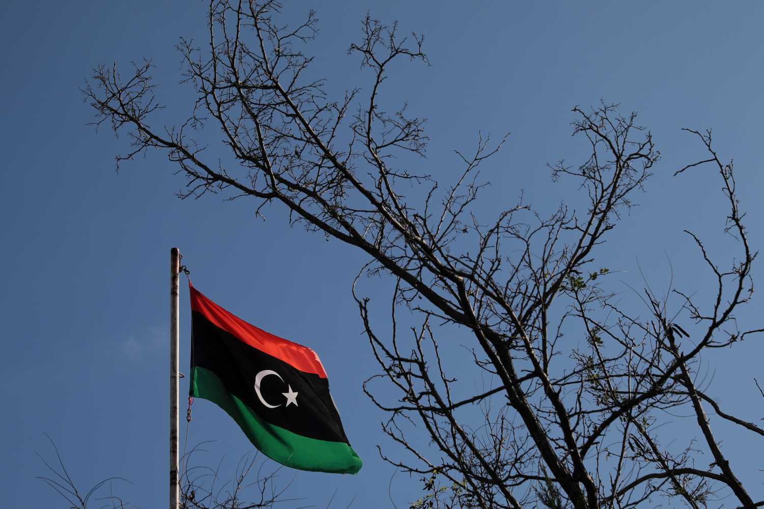 A Libyan flag flutters atop the Libyan Consulate in Athens, Greece, December 6, 2019. REUTERS/Costas Baltas