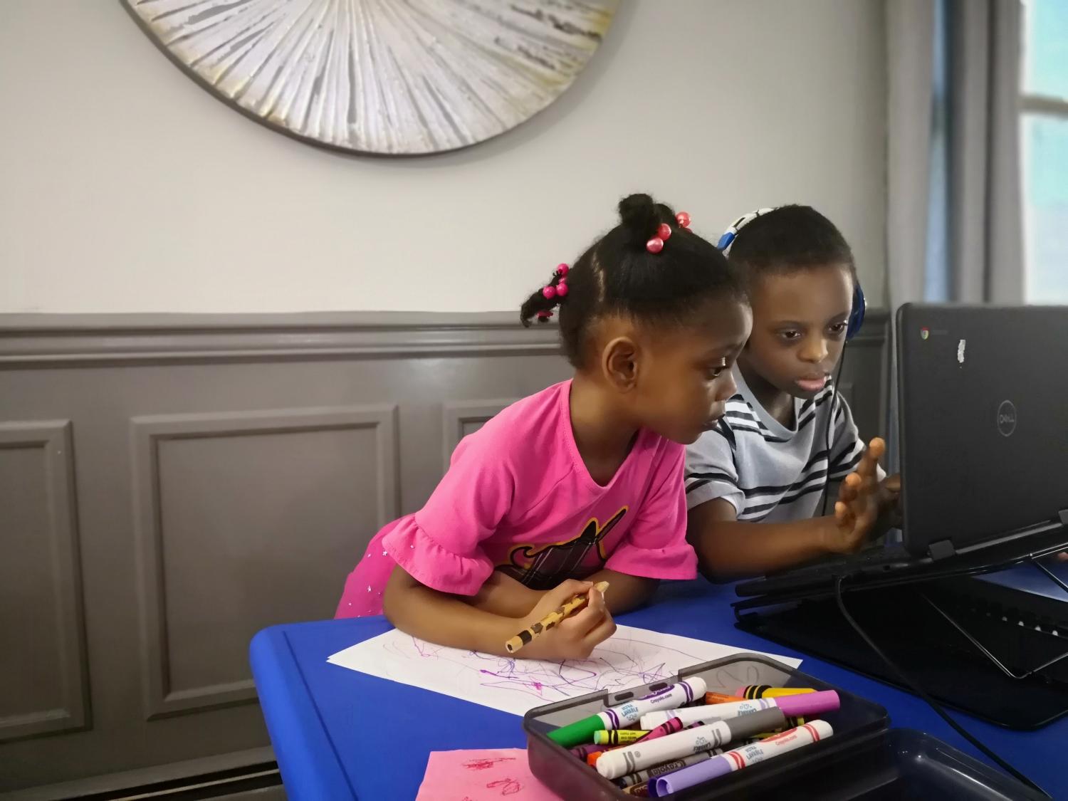 Gabrielle and Ethan Archibald take school classes virtually as schools go back online to prevent the spread of the coronavirus disease (COVID-19) in Ramsey, New Jersey, U.S. September 11, 2020. Kimberlee Bradshaw Archibald/Handout via REUTERS