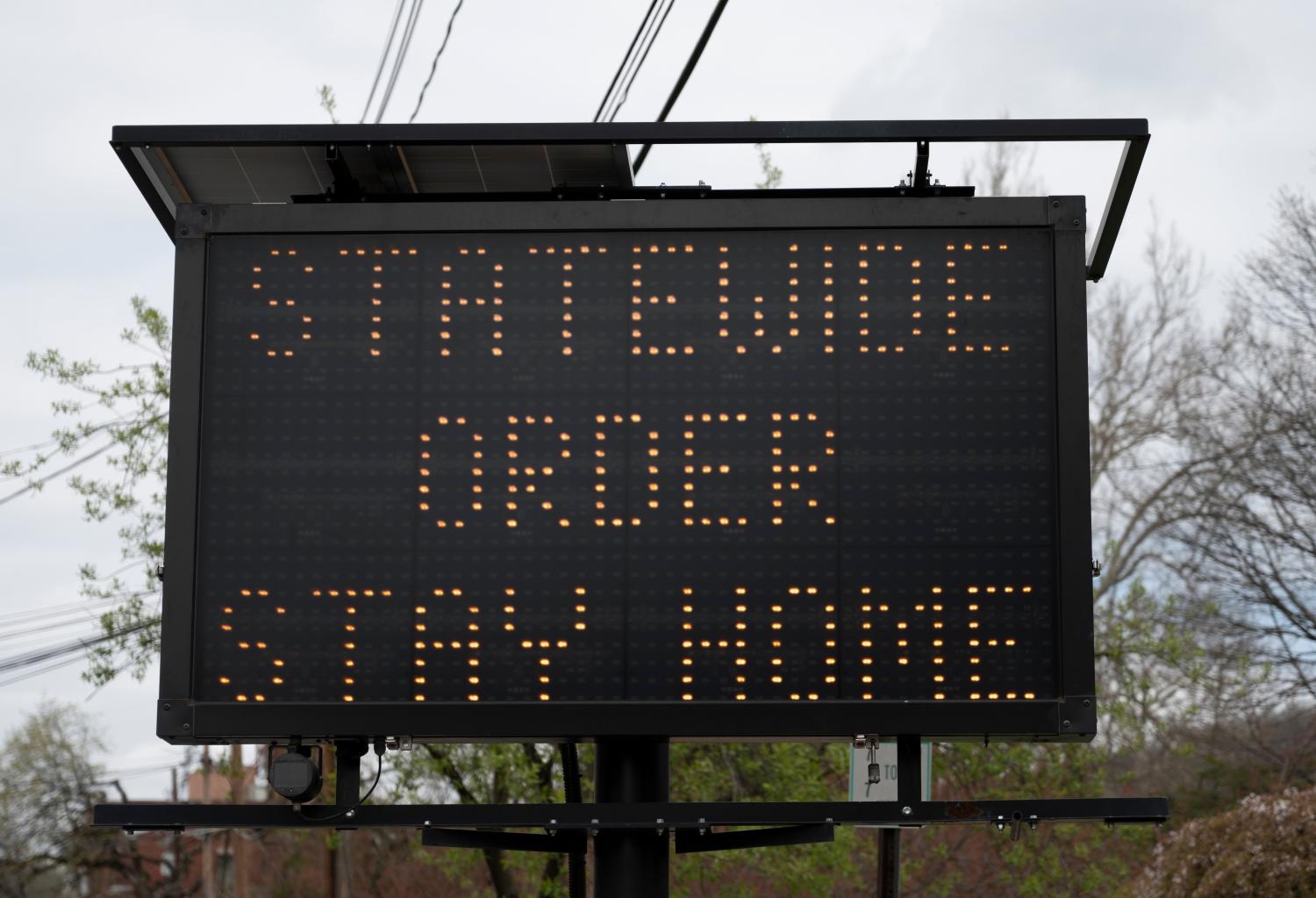 Electronic traffic sign that reads "Statewide Order Stay Home"