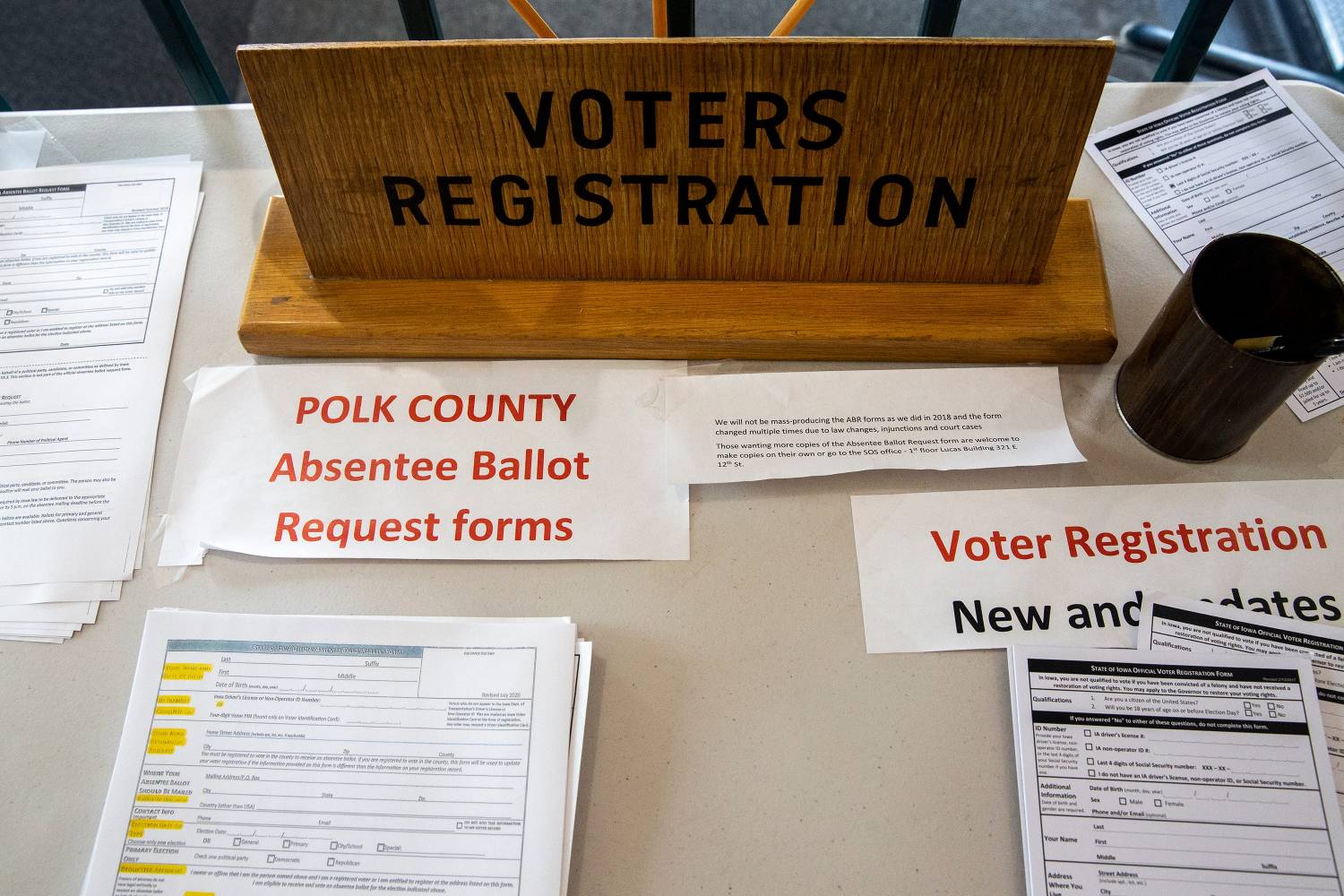 Voter registration forms and a dropbox sit outside the entrance to the Polk County Auditor's election office on Thursday, Sept. 24, 2020, in Des Moines.0924 Vote 006 Jpg