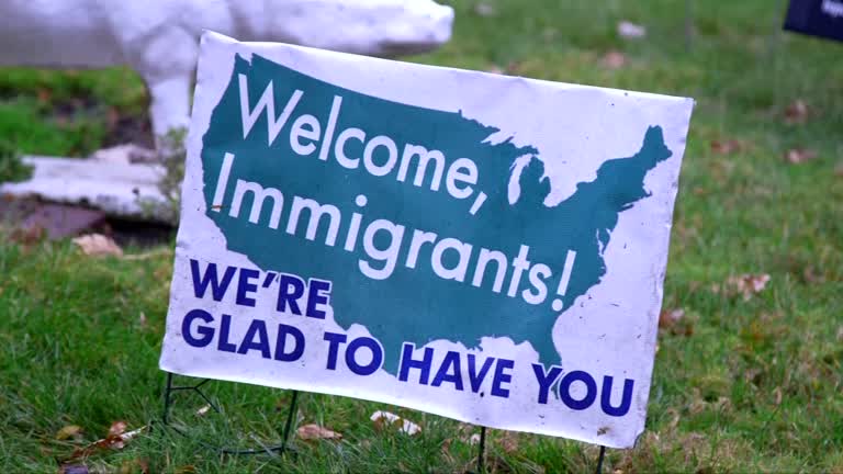 Welcome Immigrants sign