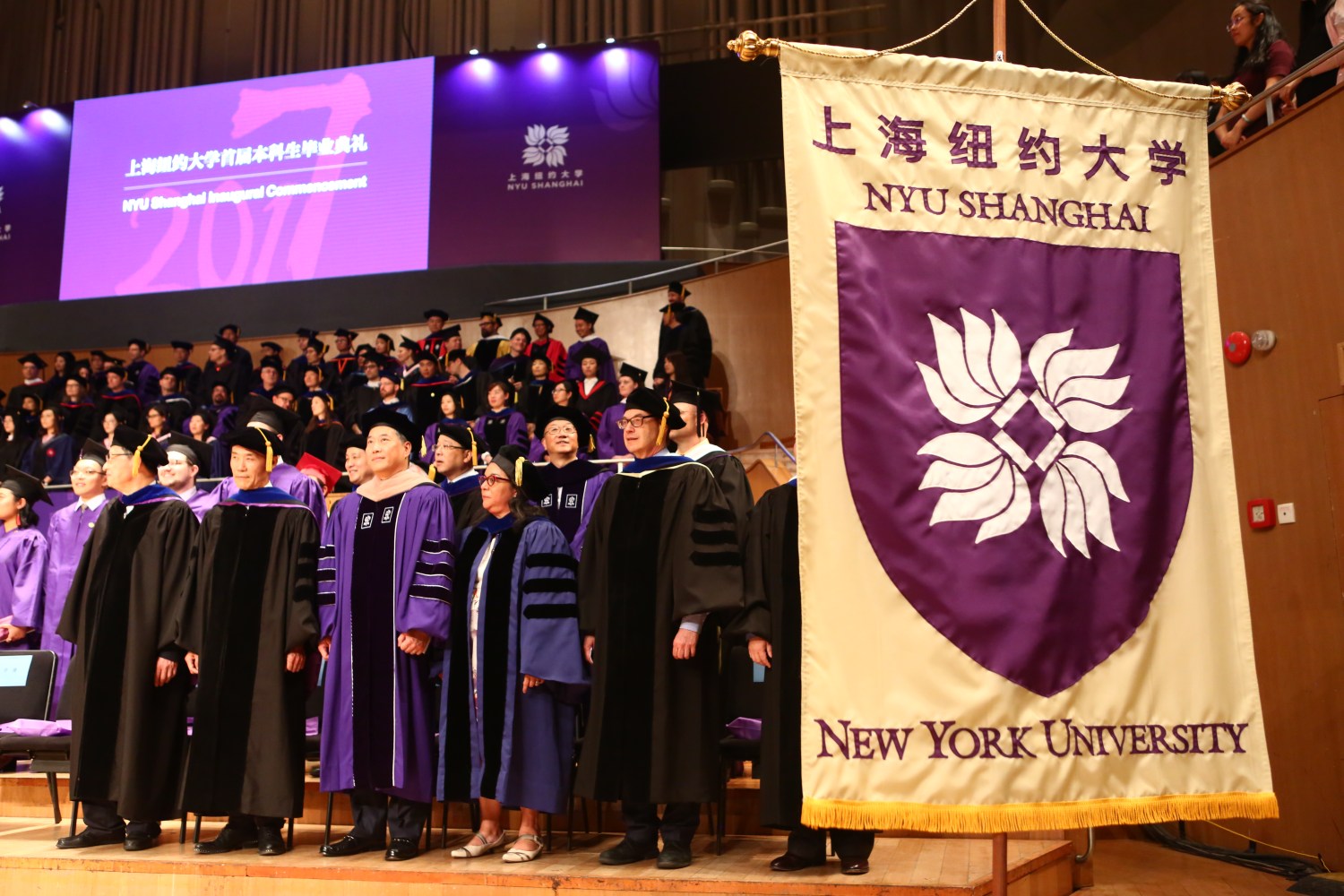 Chancellors, guests and graduates attend the first graduation ceremony of NYU Shanghai, the first Sino-US joint research university, in Shanghai, China, 28 May 2017.On May 28th, the pioneering class of 2017 at NYU Shanghai earned their NYU bachelor¡¯s degrees as well as their NYU Shanghai diplomas. The 264 graduates, who hail from China, the United States and 31 other countries, led the way into the hall of Shanghai¡¯s Oriental Arts Center packed with professors, friends, siblings and proud parents who travelled from around the world to celebrate the very first graduation of the first Sino-US joint research university. Chancellor Yu Lizhong and Vice Chancellor Jeff Lehman offered the commencement remarks. Yu asked the graduates to carry forward NYU Shanghai¡¯s academic values of independent thinking, innovation and creativity as well as its spirit of openness and inclusiveness to the advance of human beings and our society. On a day of many firsts for NYU Shanghai, both Chancellors also awarded the university¡¯s newly minted Medal of Honor to two prominent figures, China¡¯s former ambassador to the United States, Zhou Wenzhong, and real estate developer, Wang Shi. Both made brief congratulatory remarks to the graduating students, their families and dignitaries in attendance.No Use China. No Use France.