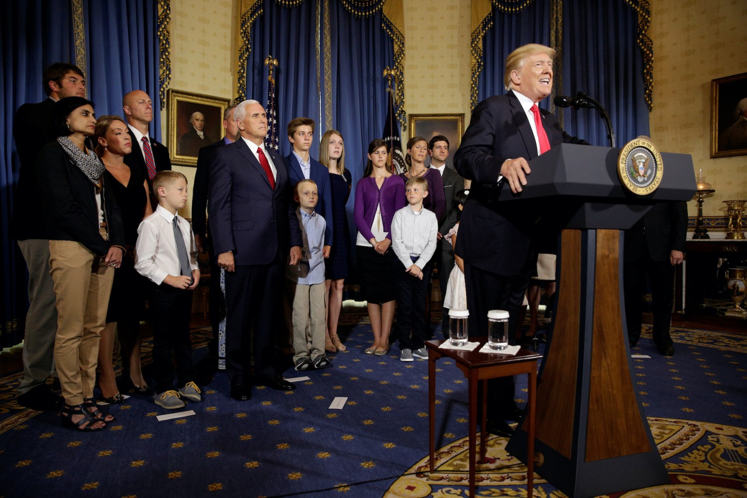 U.S. President Donald Trump calls on Republican Senators to move forward and vote on a healthcare bill to replace the Affordable Care Act as people negatively affected by the law stand behind him in the Blue Room of the White House in Washington, U.S., July 24, 2017.   REUTERS/Joshua Roberts