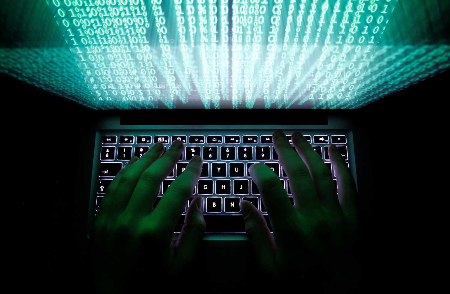 A man types on a computer keyboard in Warsaw in this February 28, 2013 illustration file picture. REUTERS/Kacper Pempel