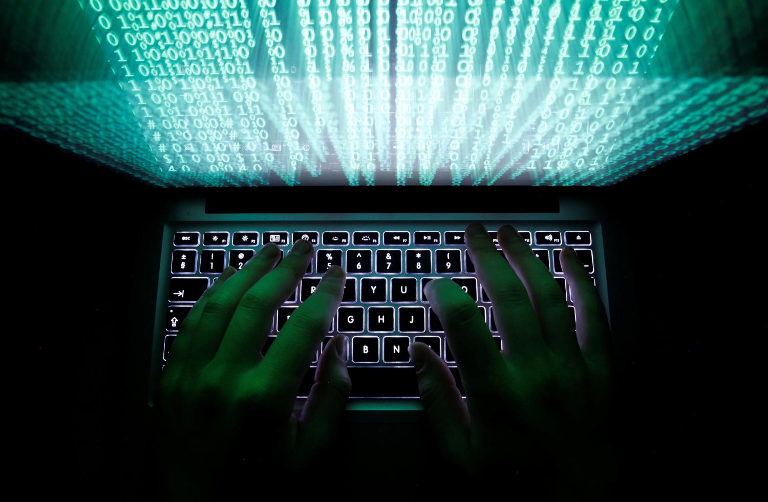A man types on a computer keyboard in Warsaw in this February 28, 2013 illustration file picture. REUTERS/Kacper Pempel