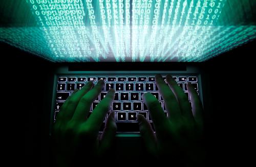 A man types on a computer keyboard in Warsaw in this February 28, 2013 illustration file picture. REUTERS/Kacper Pempel