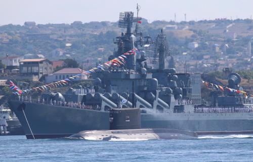 Russian sailors line up onboard a warship near a military submarine during a rehearsal for the Navy Day parade in the Black Sea port of Sevastopol, Crimea July 26, 2019. REUTERS/Alexey Pavlishak