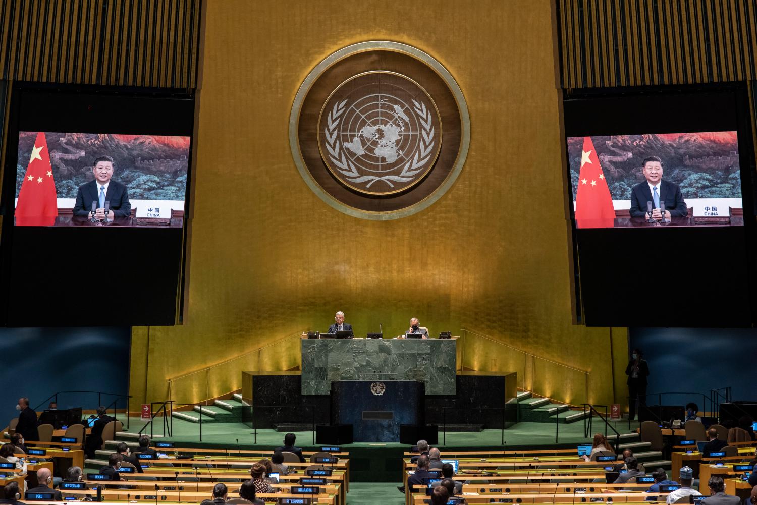 Chinese President Xi Jinping (on screens), addresses the general debate of the General Assembly’s 75th session.
