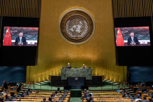 Chinese President Xi Jinping (on screens), addresses the general debate of the General Assembly’s 75th session.