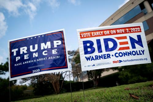 FILE PHOTO: Yard signs supporting U.S. President Donald Trump and Democratic U.S. presidential nominee and former Vice President Joe Biden are seen outside of an early voting site at the Fairfax County Government Center in Fairfax, Virginia, U.S., September 18, 2020. REUTERS/Al Drago/File Photo