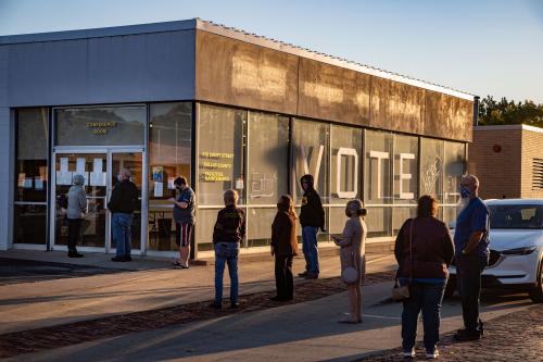 Voters wait in line to cast their ballots in Adel as early voting begins in Iowa Monday, Oct. 5, 2020.Vote6 Jpg