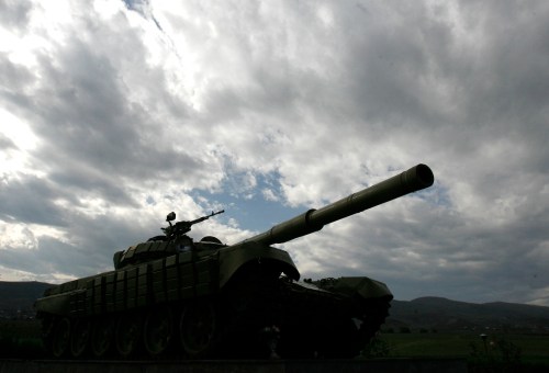 A Soviet-made tank is seen near the town of Agdam, controlled by Nagorno Karabakh, and which was completely destroyed during fighting between Karabakh and Azerbaijan forces in 1990s, October 29, 2009. Largely forgotten by the outside world, the remote territory is now the centre of diplomatic attention because it could torpedo a fragile peace deal between historic enemies Armenia and Turkey. Picture taken October 29, 2009. To match feature ARMENIA-AZERBAIJAN/KARABAKH  REUTERS/David Mdzinarishvili (AZERBAIJAN POLITICS DISASTER MILITARY)