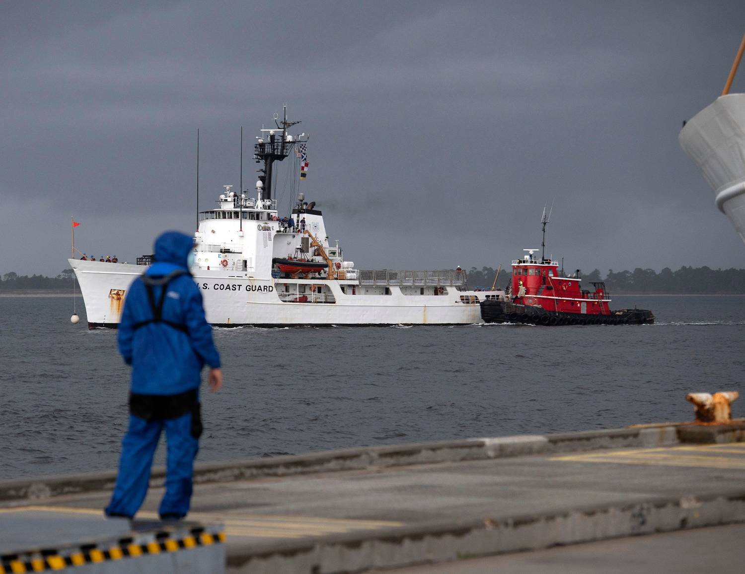 The U.S Coast Guard Cutter Diligence (WMEC-616) arrives at its new homeport at Naval Air Station Pensacola on a stormy day Monday, July 27, 2020. The 210-foot Reliance-class cutter joins the cutters Decisive and the Dauntless currently calling Pensacola home.Uscg Homeport Diligence