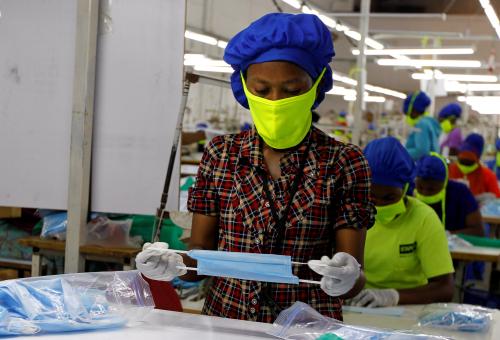 A worker is seen at a production line within the Shona Textiles Export Processing Zone (EPZ) as they make protective face masks, as a measure to stem the coronavirus disease (COVID-19) outbreak, in Athi River near Nairobi, Kenya April 14, 2020. REUTERS/Njeri Mwangi