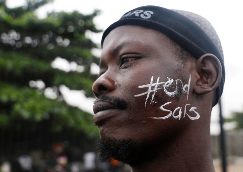 'End Sars', referring to the Special Anti-Robbery Squad police unit, reads on a demonstrator's face during a protest over alleged police brutality in Lagos, Nigeria October 17, 2020. REUTERS/Temilade Adelaja