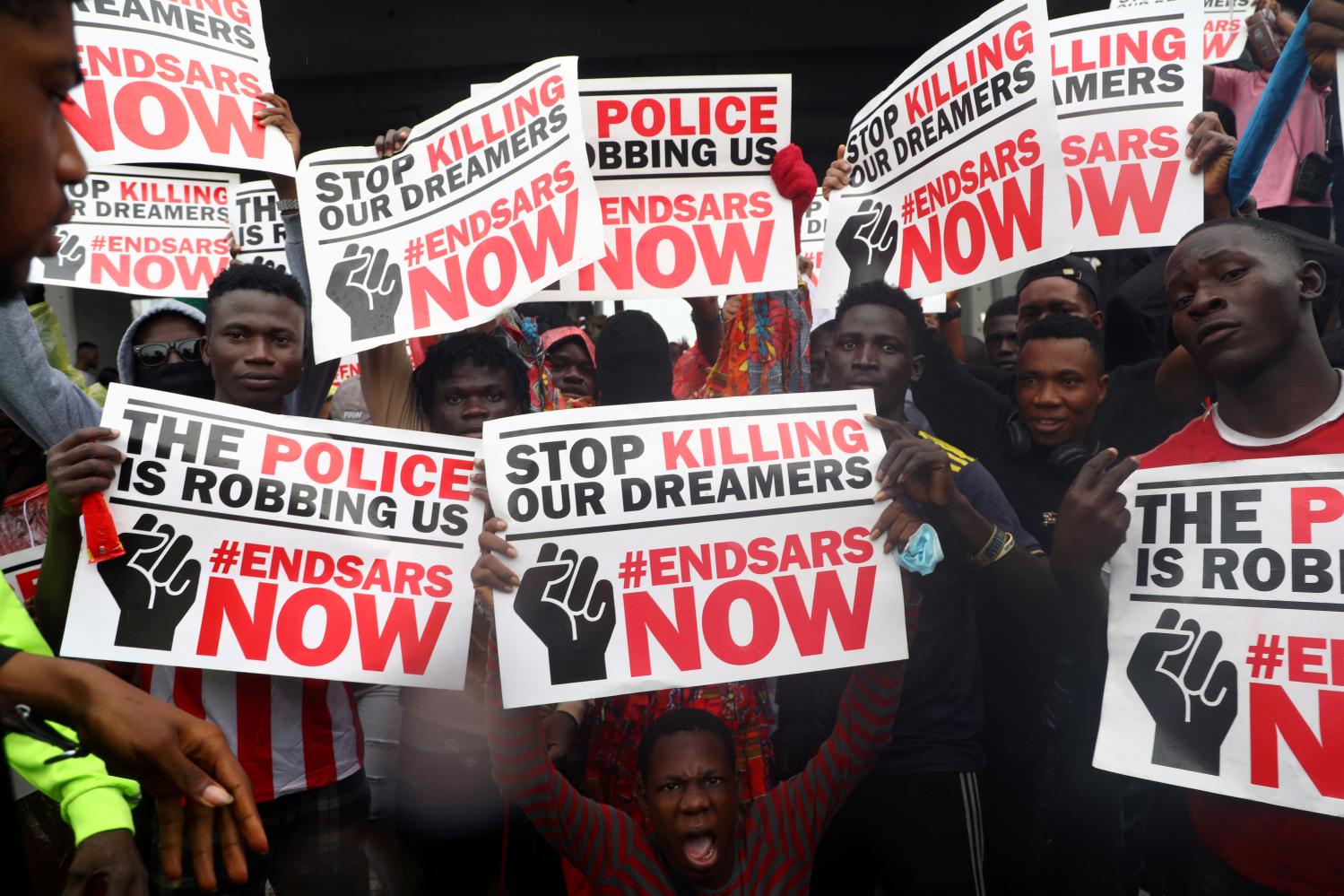 FILE PHOTO: Demonstrators carry banners during a protest over alleged police brutality, in Lagos, Nigeria October 14, 2020. REUTERS/Temilade Adelaja/File Photo