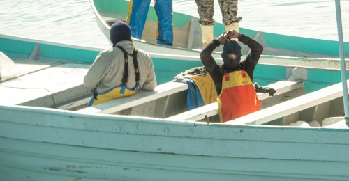 Masked men on skiffs are seen fishing illegally inside the Vaquita Refuge, a UNESCO World Heritage Site located in Mexico’s Upper Gulf of California, off San Felipe, Baja California, Mexico March 3, 2020 in this picture released by the Sea Shepherd. Sea Shepherd/Handout via REUTERS   ATTENTION EDITORS - THIS IMAGE HAS BEEN SUPPLIED BY A THIRD PARTY. MANDATORY CREDIT SEA SHEPHERD.
