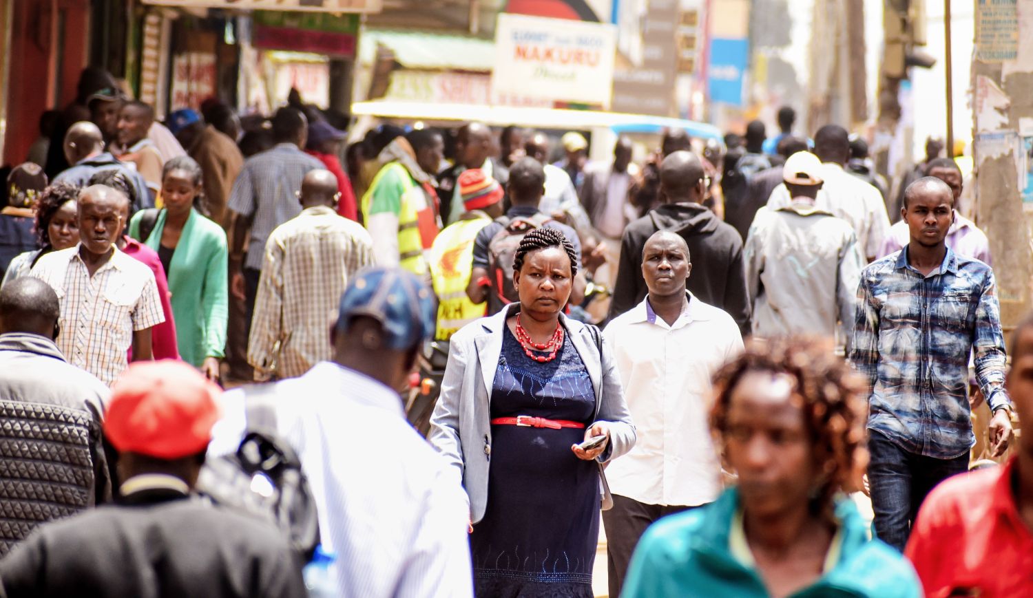 Nairobi, Kenya - April 28 2018: People walking along a busy street in the crowded down town of Nairobi City, Kenya, East Africa