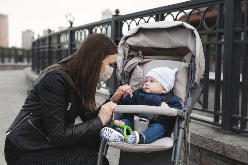 mother in mask with baby