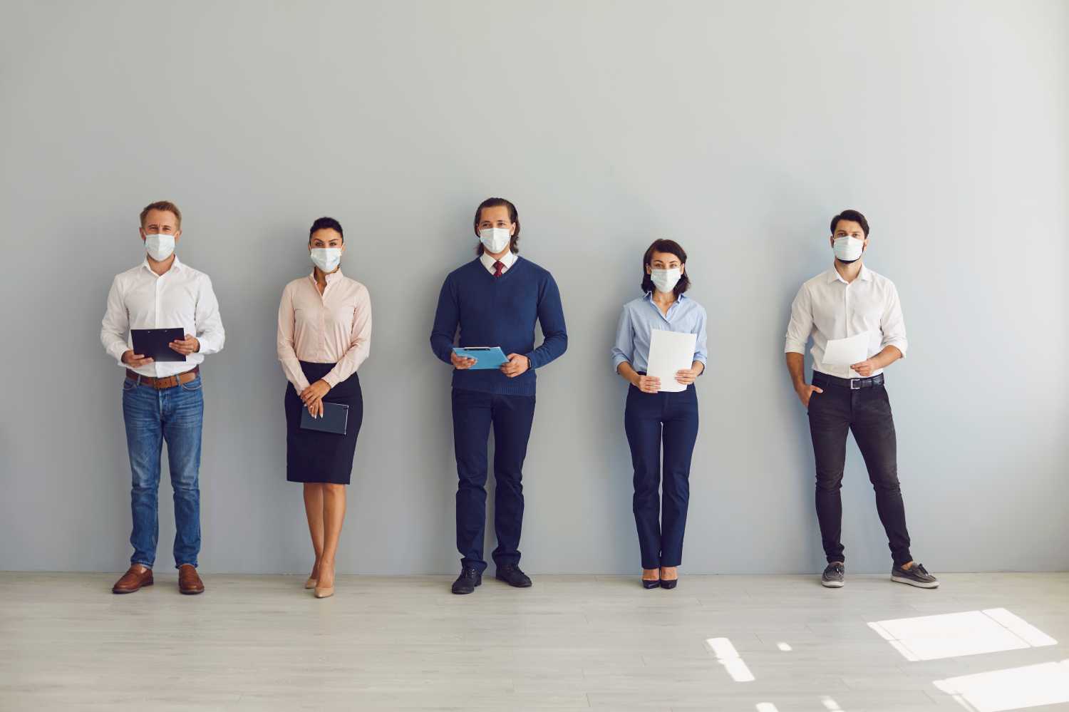 Stock Photo of Job Seekers with Masks