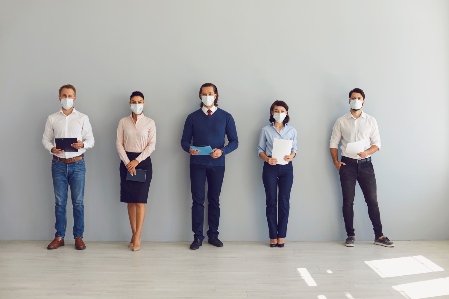 Stock Photo of Job Seekers with Masks