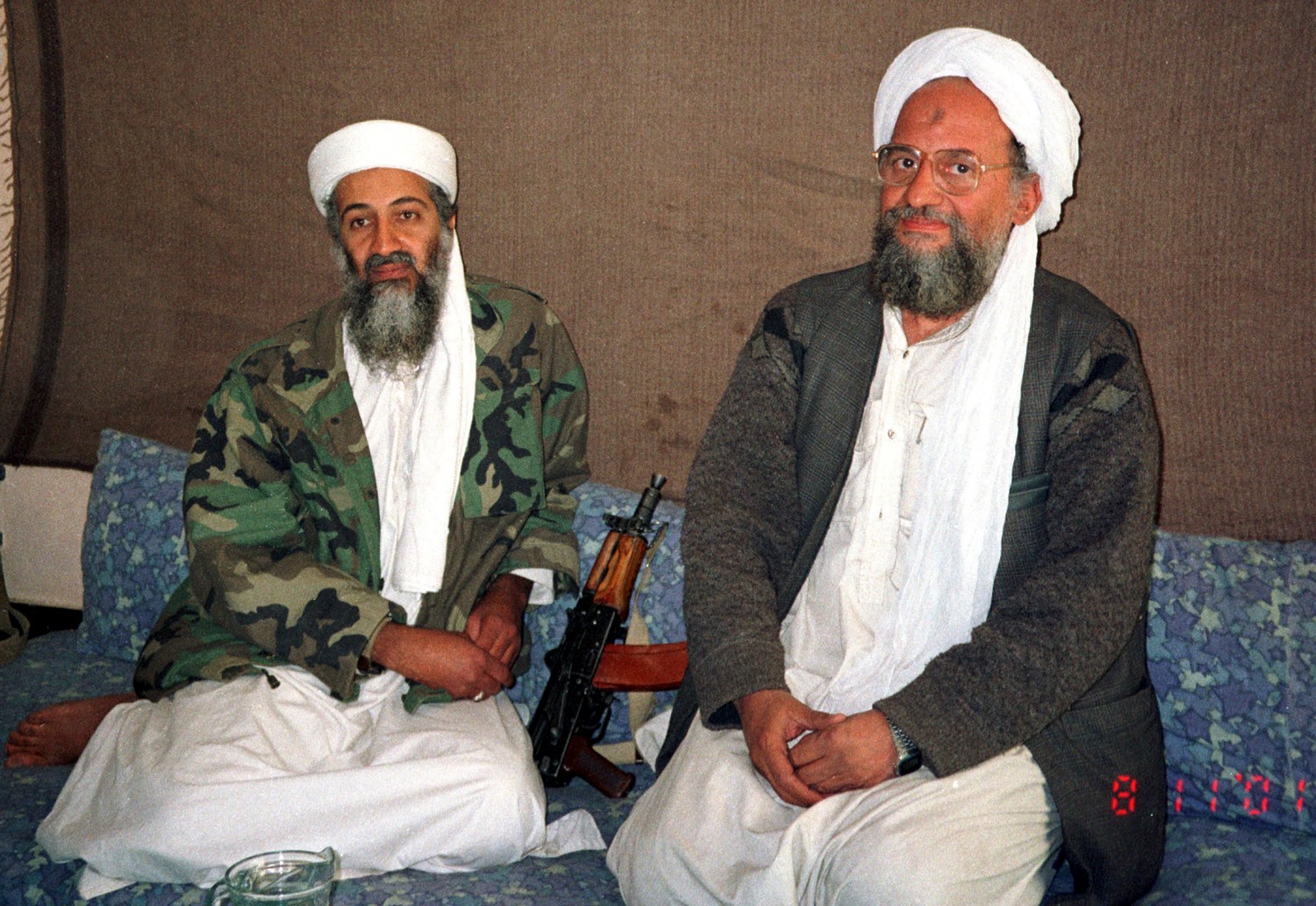 Osama bin Laden (L) sits with his adviser and purported successor Ayman al-Zawahri, an Egyptian linked to the al Qaeda network, during an interview with Pakistani journalist Hamid Mir (not pictured) in an image supplied by the respected Dawn newspaper November 10, 2001. Al Qaeda's elusive leader Osama bin Laden was killed in a mansion outside the Pakistani capital Islamabad, U.S. President Barack Obama said on May 1, 2011.   REUTERS/Hamid Mir/Editor/Ausaf Newspaper for Daily Dawn (AFGHANISTAN - Tags: POLITICS CONFLICT IMAGES OF THE DAY)