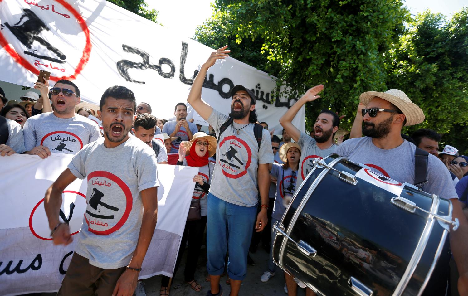 A demonstrator hits a drum during a demonstration against a bill that would protect those accused of corruption from prosecution in front of Assembly of People's Representatives headquarters in Tunis, Tunisia, July 28, 2017. REUTERS/Zoubeir Souissi