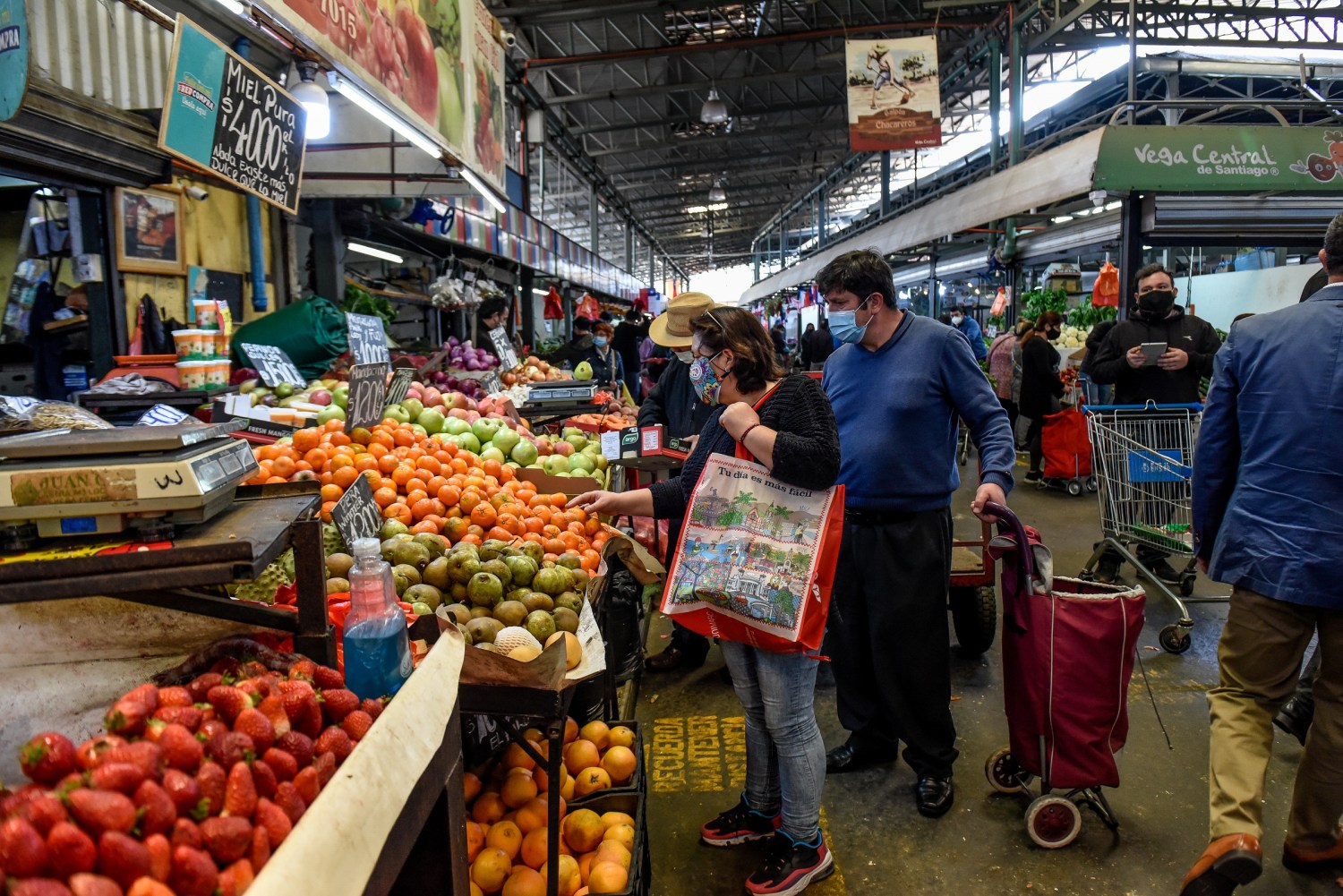 People work in a market in Santiago de Chile, Chile.