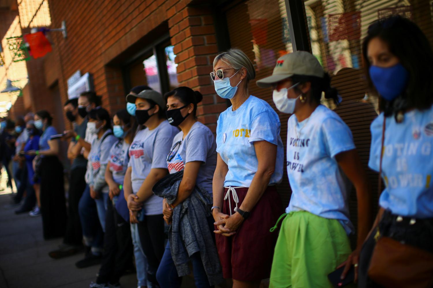 People attend an ecumenical worship service at Mi Familia Vota headquarters to promote the importance of the Latino vote in Phoenix, Arizona U.S., November 1, 2020. REUTERS/Edgard Garrido