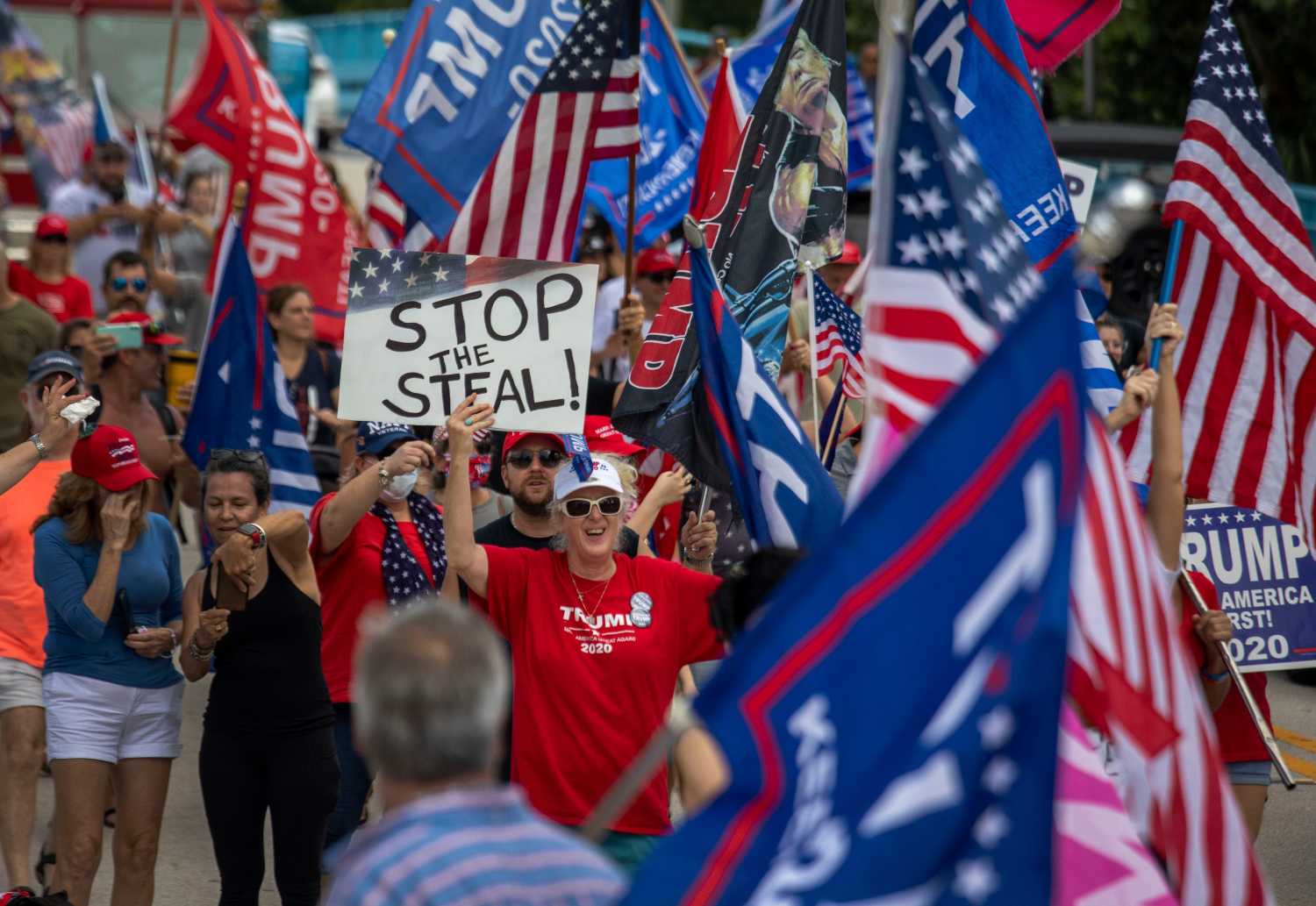 Trump supporters cheer as they march to protest the election outcome