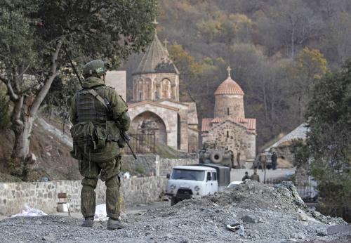 NAGORNO-KARABAKH - NOVEMBER 15, 2020: A Russian peacekeeper guards the area near the Dadivank monastery. On 10 November, Armenias Prime Minister Nikol Pashinyan, Russias President Vladimir Putin, and Azerbaijans President Ilham Aliyev signed a joint statement on a complete ceasefire in Nagorno-Karabakh. The Russian leader said the Azerbaijani and Armenian sides would maintain the positions that they had held and Russian peacekeepers would be deployed to the region. According to the document, Armenia has to hand over the Nagorno-Karabakh districts of Kalbajar, Lachin, and Agdam, to Azerbaijan till November 15, December 1, and November 20, respectively. Stanislav Krasilnikov/TASS.No use Russia.