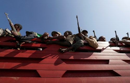 FILE PHOTO: Members of Amhara region militias ride on their truck as they head to the mission to face the Tigray People's Liberation Front (TPLF), in Sanja, Amhara region near a border with Tigray, Ethiopia November 9, 2020. REUTERS/Tiksa Negeri//File Photo