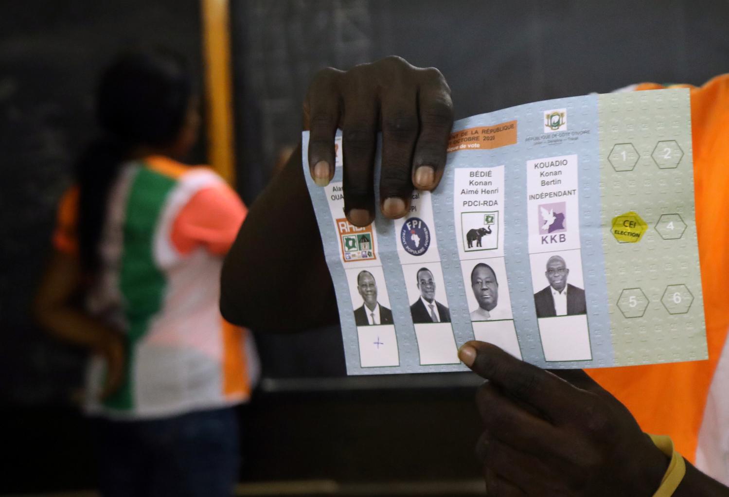Officials count the presidential election ballots in Abidjan, Ivory Coast October 31, 2020. REUTERS/Luc Gnago