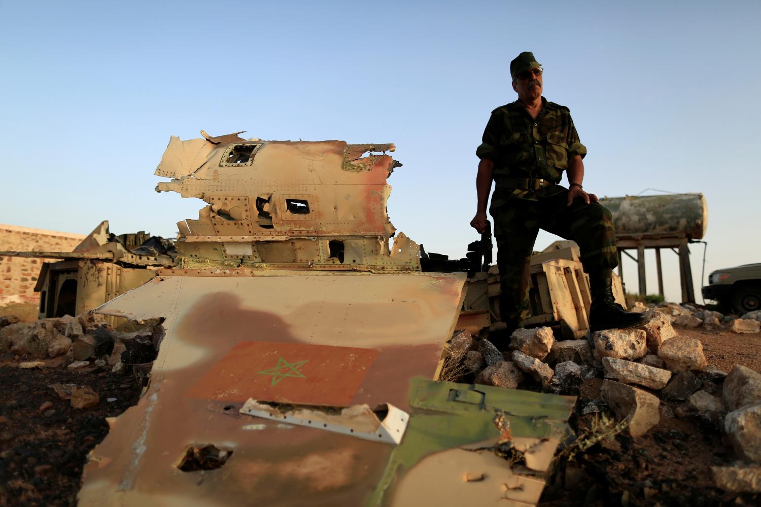 Sidi Brahim Mohamed Embarek talks to Reuters journalists as he stands beside the wreckage of a Moroccan air force F-5, which was shot down by the Polisario in a 1991 battle in the Western Sahara war, in Tifariti, September 9, 2016. REUTERS/ Zohra Bensemra           SEARCH “POLISARIO” FOR THIS STORY. SEARCH "WIDER IMAGE" FOR ALL STORIES.    TPX IMAGES OF THE DAY