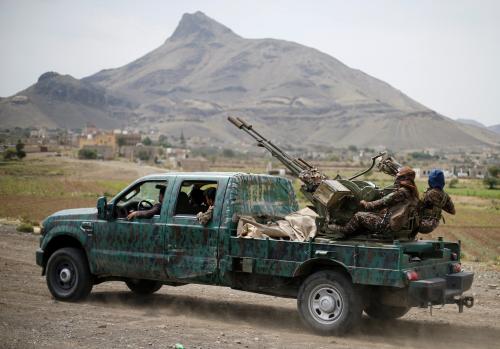 Houthi fighters man a machine gun mounted on a military truck as they parade during a gathering of Houthi loyalists on the outskirts of Sanaa, Yemen July 8, 2020. REUTERS/Khaled Abdullah