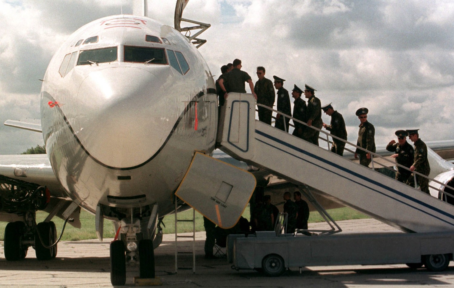 A group of Ukrainian officers enter the U.S. OC-135B observation aircraft at a military base near Kiev June 23. The U.S. military mission arrived in Ukraine for a two-day series of overflights using both American and Ukrainian observation aircrafts according to "The Open Skies Treaty " signed in 1992 between member states of NATO and the former Warsaw Pact.YK/FMS