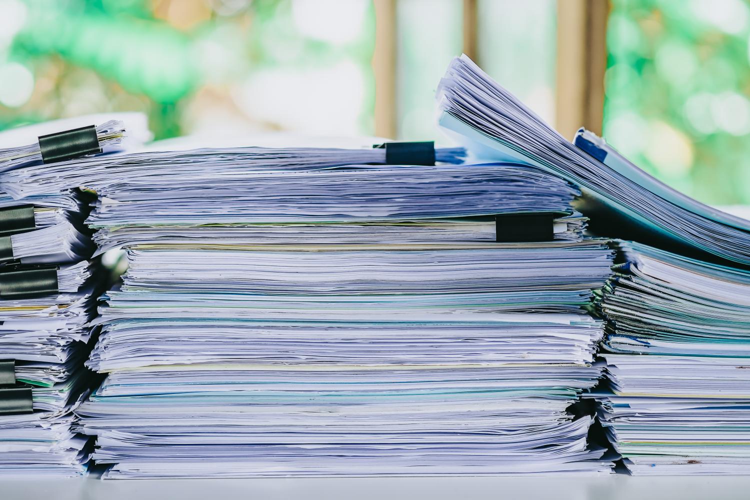 stack of reports on a desk