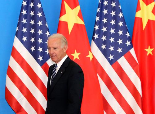 U.S. Vice-President Joe Biden arrives with his Chinese counterpart Xi Jinping (not pictured) at a China-US Business Dialogue in the Beijing Hotel in Beijing August 19, 2011. China and the United States "have a responsibility to strengthen macro-economic policy coordination and together boost market confidence," Xi told visiting Biden on Thursday, according to Chinese state media. REUTERS/How Hwee Young/Pool (CHINA - Tags: POLITICS)