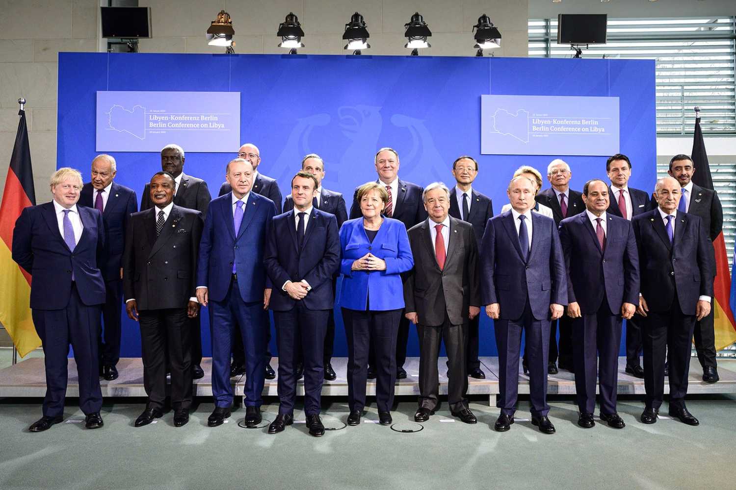 German Chancellor Angela Merkel (C) and United Nations Secretary General Antonio Guterres (C R) poses for a group picture with the participants of the International conference on Libya, at the Federal Chancellery.