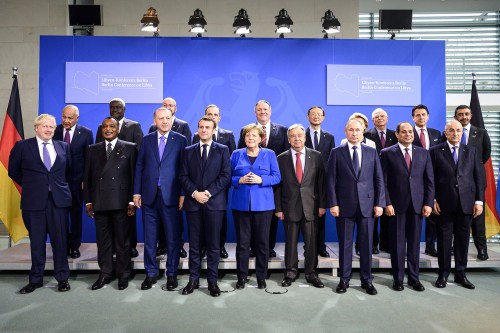 German Chancellor Angela Merkel (C) and United Nations Secretary General Antonio Guterres (C R) poses for a group picture with the participants of the International conference on Libya, at the Federal Chancellery.