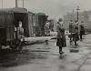 Mask-wearing women hold stretchers near ambulances during the Spanish Flu pandemic in St. Louis, Missouri, in October 1918.