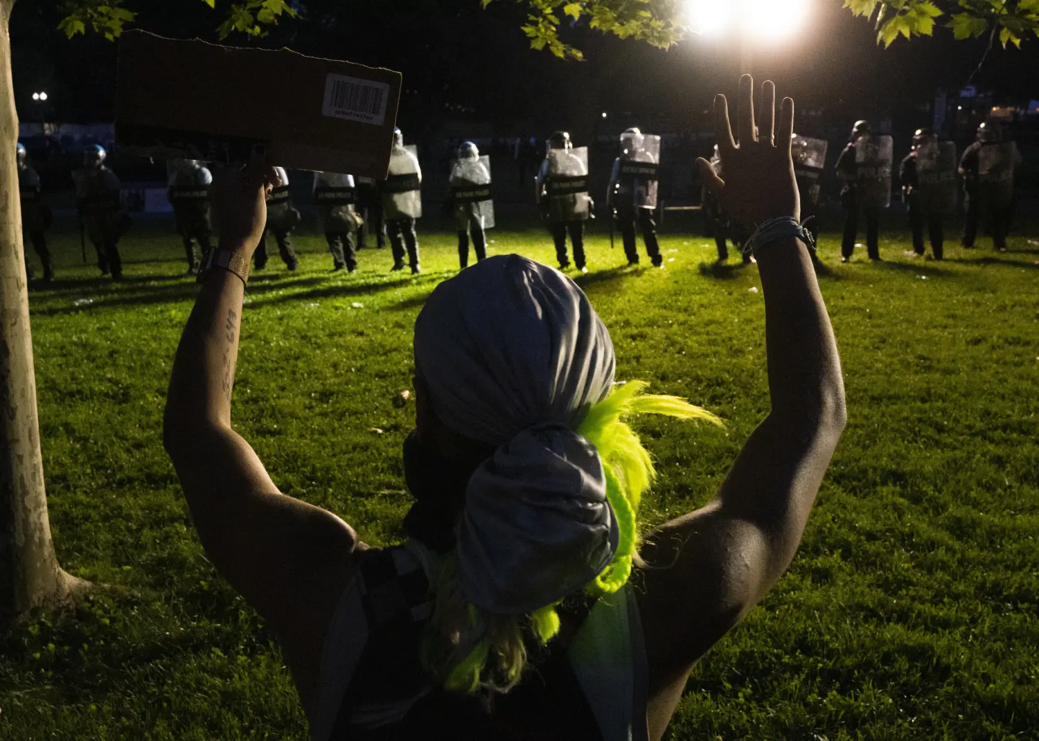 A protestor holds their hands in the air as police and National Guard look on during a protest in Lafayette Square in Washington, D.C., U.S., on Sunday, May 31, 2020, following the death of an unarmed black man at the hands of Minnesota police on May 25, 2020. Photo by Stefani Reynolds / CNP/ABACAPRESS.COM