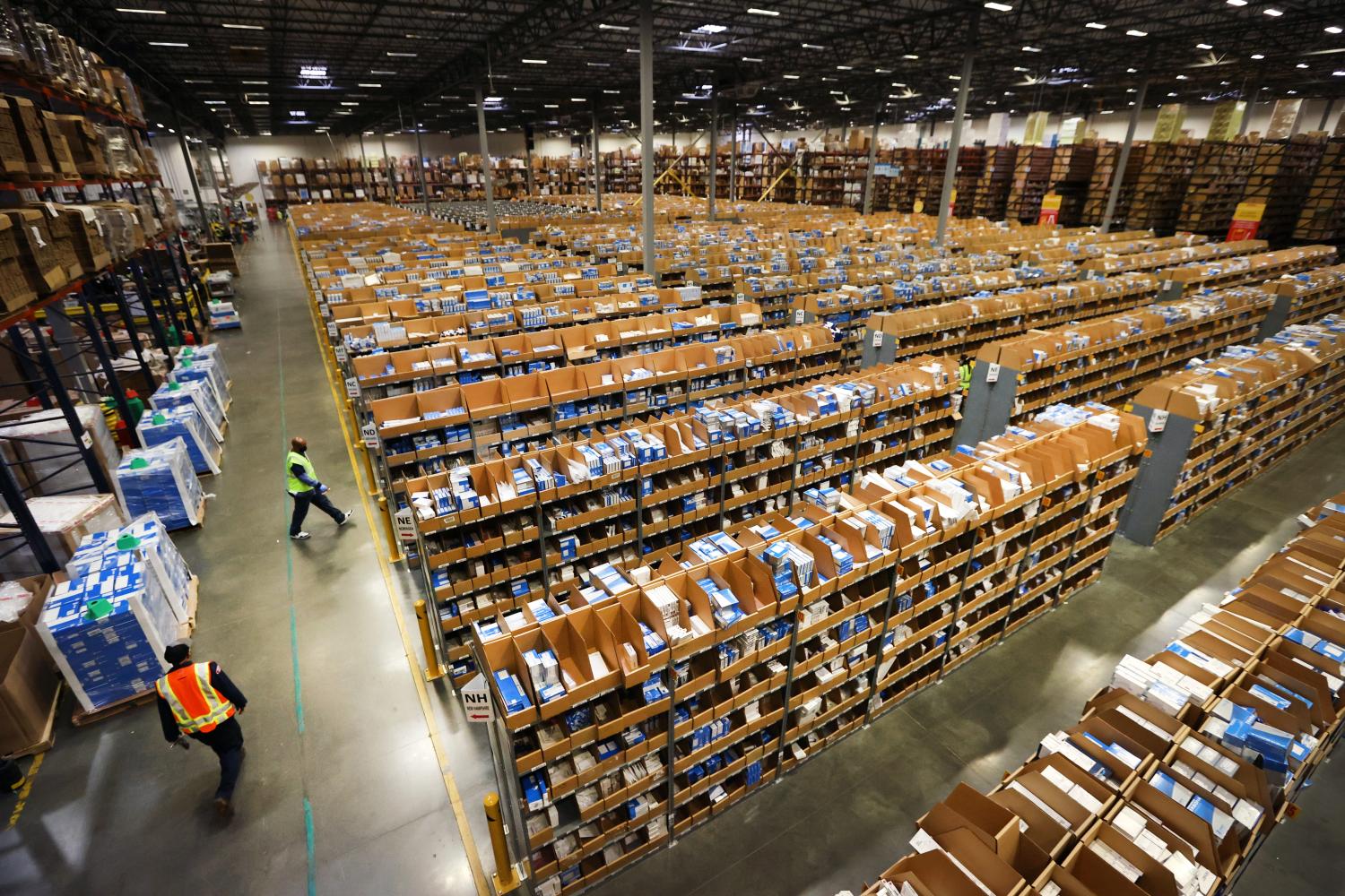 Rows of bins containing tens of thousands of pieces of medical eqiupment awaiting distribution in a large warehouse.