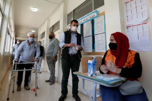 People wait to cast their votes during parliamentary elections, amid fears over rising number of the coronavirus disease (COVID-19) cases, in Amman, Jordan November 10, 2020. REUTERS/Muhammad Hamed