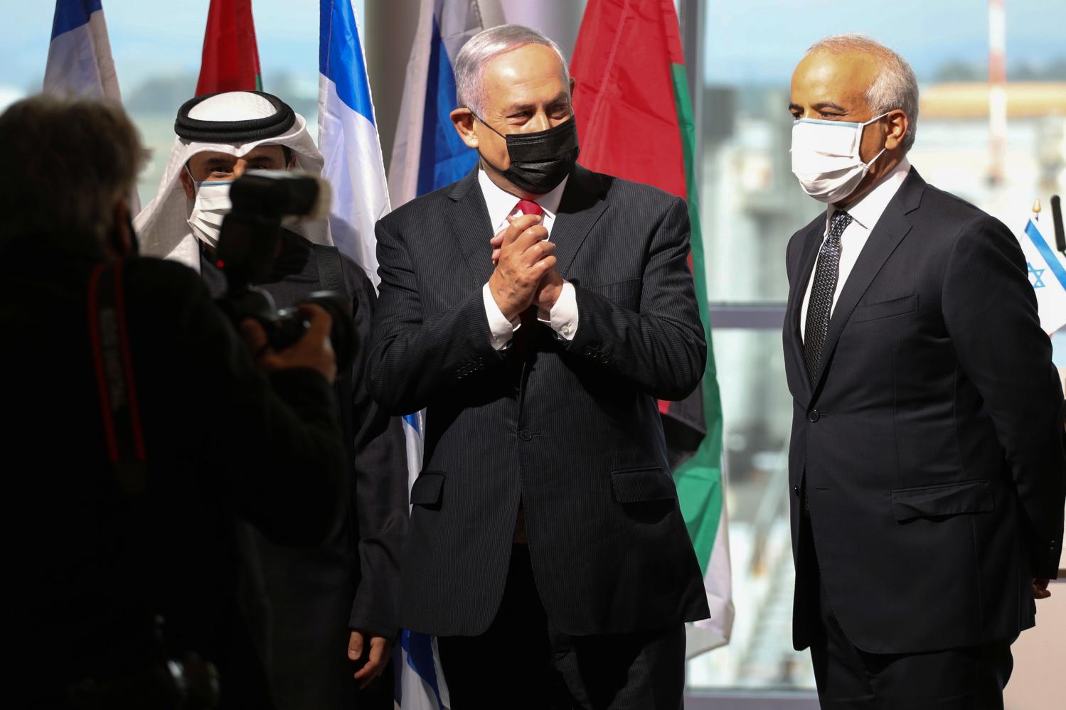 Israeli Prime Minister Benjamin Netanyahu gestures during a welcoming ceremony upon the landing of a United Arab Emirates airline flydubai flight at Ben Gurion International Airport, near Tel Aviv, Israel November 26, 2020. REUTERS/Emil Salman/Pool