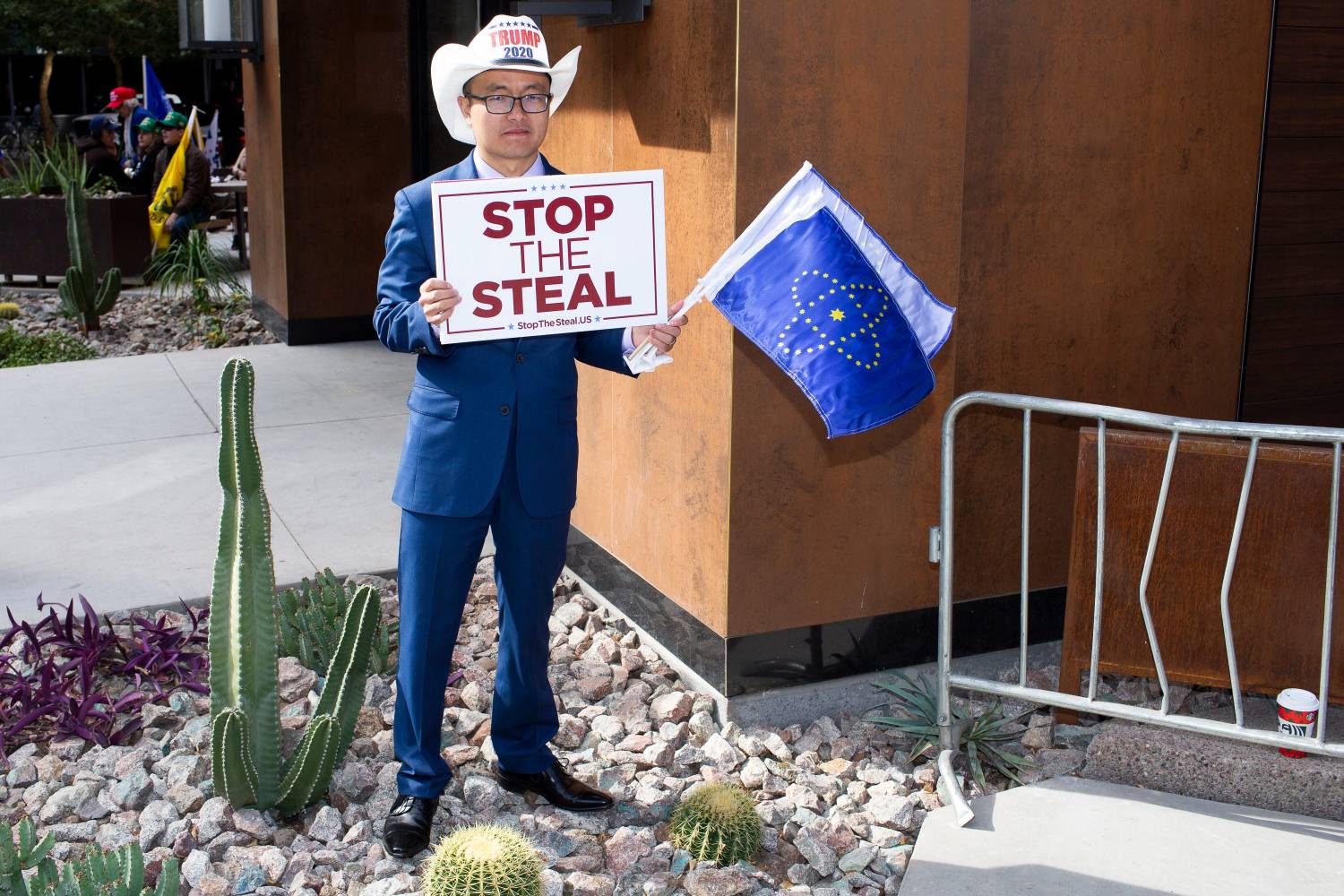 A supporter of President Donald Trump hold a sign reading "Stop the steal" while protesting against Trump's loss in the 2020 election.
