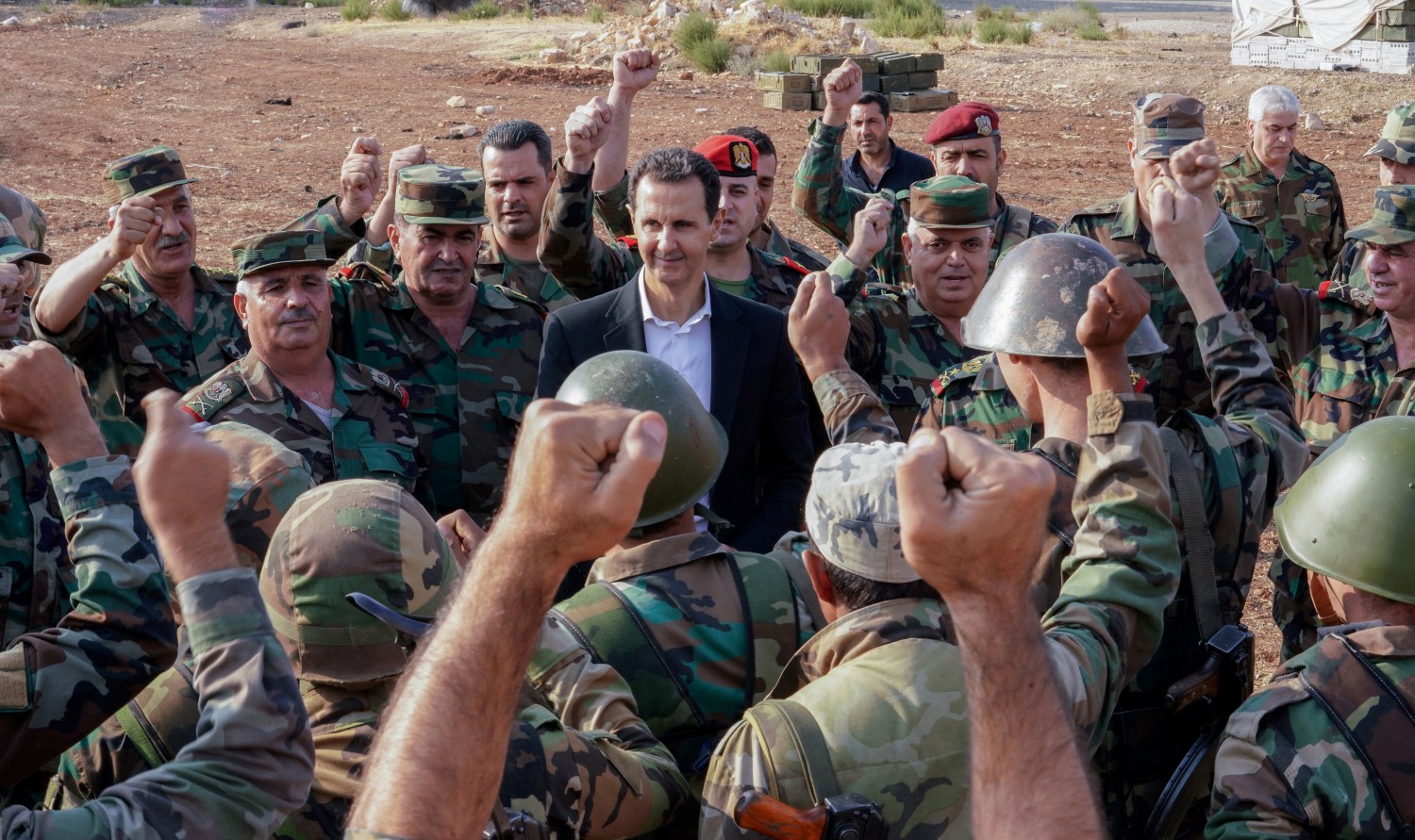 Syrian President Bashar al Assad visits Syrian army troops in war-torn northwestern Idlib province, Syria, in this handout released by SANA on October 22, 2019. SANA/Handout via REUTERS ATTENTION EDITORS - THIS IMAGE WAS PROVIDED BY A THIRD PARTY. REUTERS IS UNABLE TO INDEPENDENTLY VERIFY THIS IMAGE.
