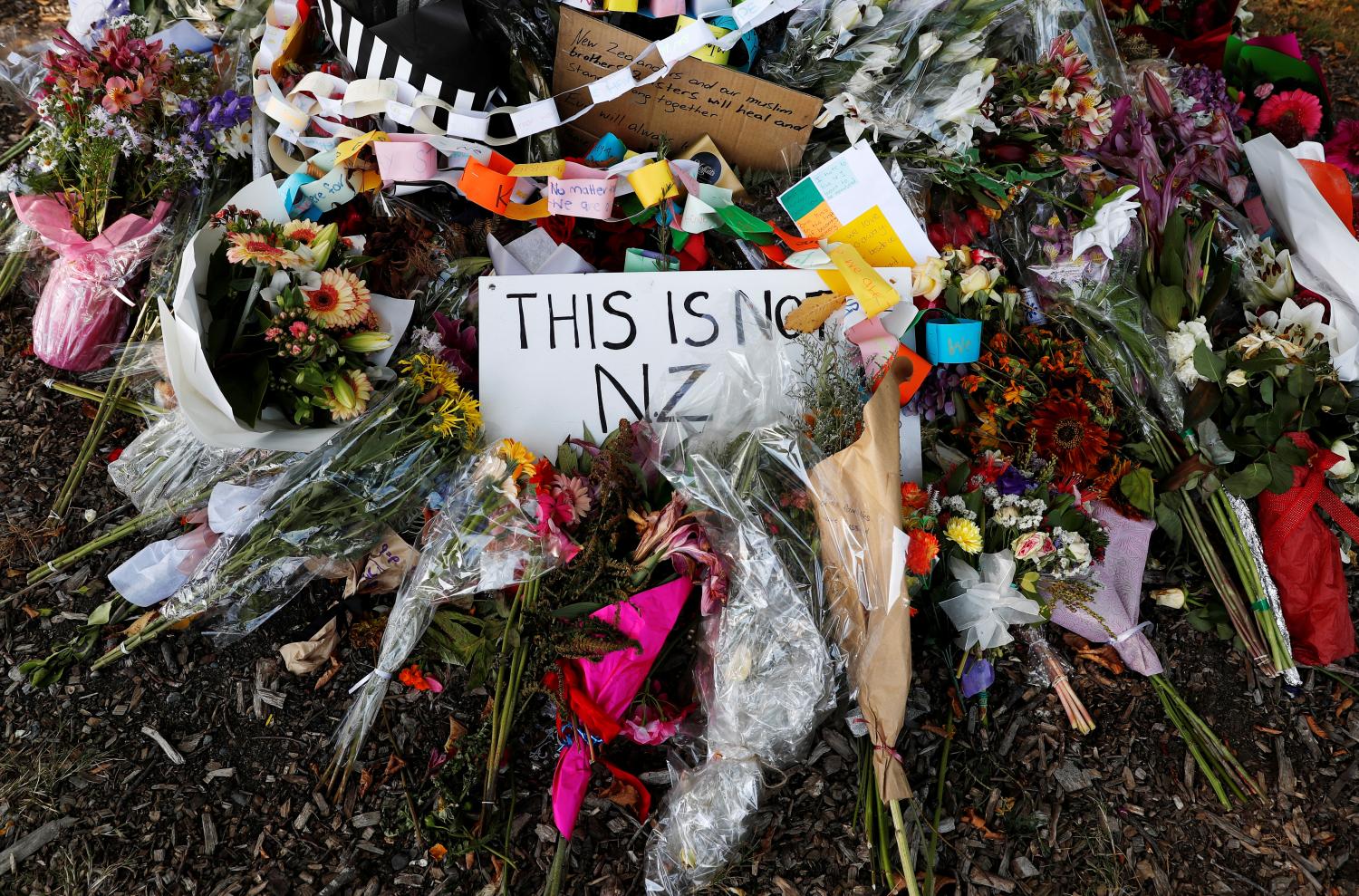 Flower tributes are pictured outside Al-Noor mosque after it was reopened in Christchurch, New Zealand March 23, 2019. REUTERS/Edgar Su