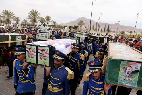 Honor guards carry coffins of Houthi fighters killed in recent fighting against forces of the internationally-recognized government, during a funeral in Sanaa, Yemen November 25, 2020. REUTERS/Khaled Abdullah
