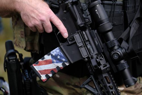 A man holds an assault rifle as Proud Boys gather in Portland, Ore., at Delta Park on September 26, 2020, in support of Kenosha shooter Kyle Rittenhouse and Aaron 'Jay' Danielson who was shot dead by an antifascist protester during the ongoing Black Lives Matter protests in the city. (Photo by Alex Milan Tracy/Sipa USA)No Use UK. No Use Germany.